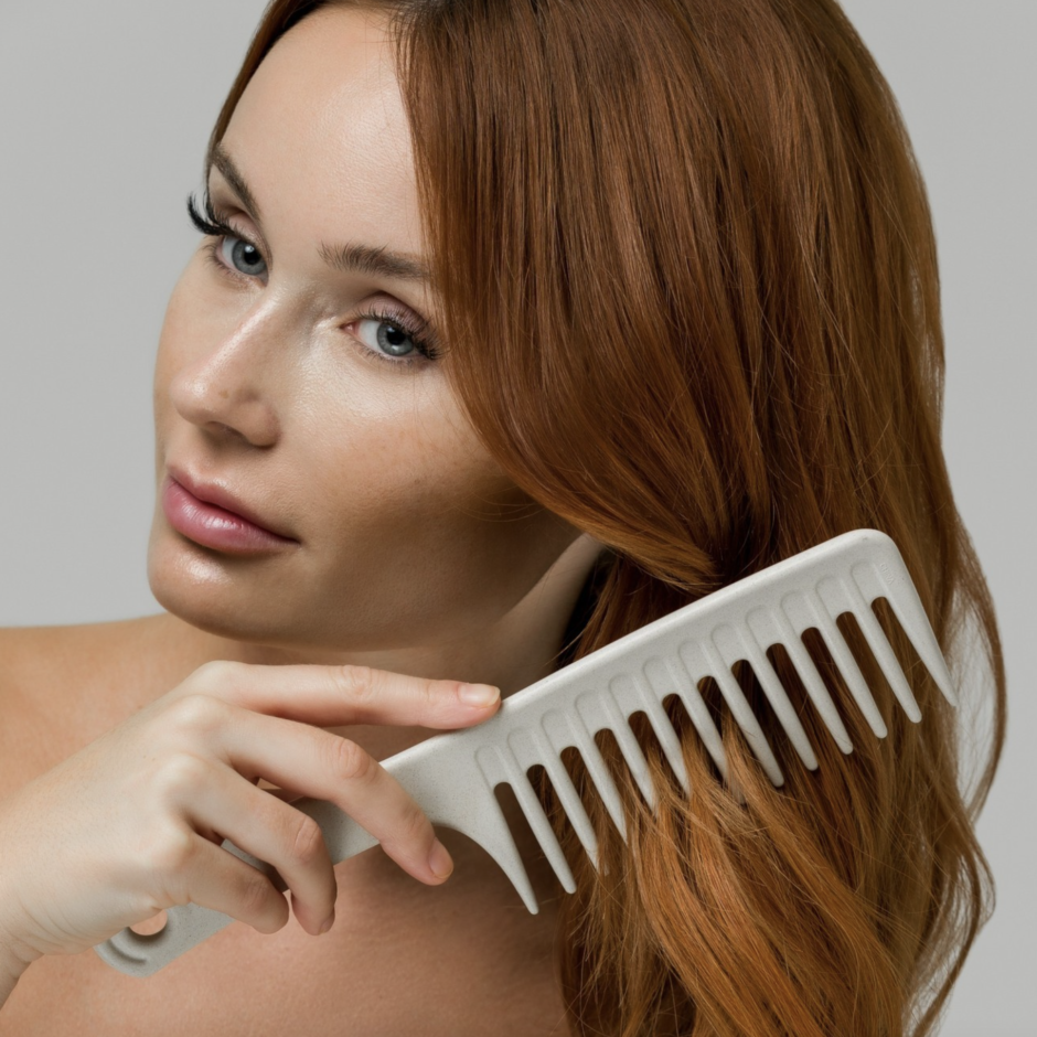 Model brushing hair with Wide Tooth Comb