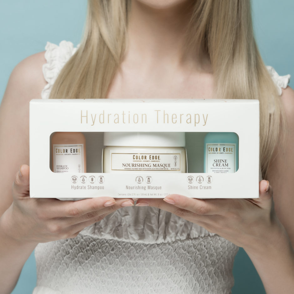 Model holding up Hydration Therapy bundle